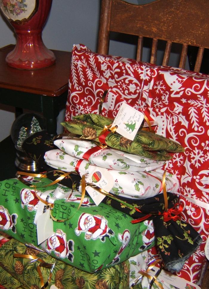 pile of gifts wrapped in fabric