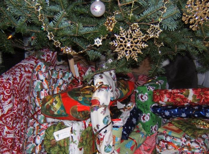 fabric wrapped gifts under the tree