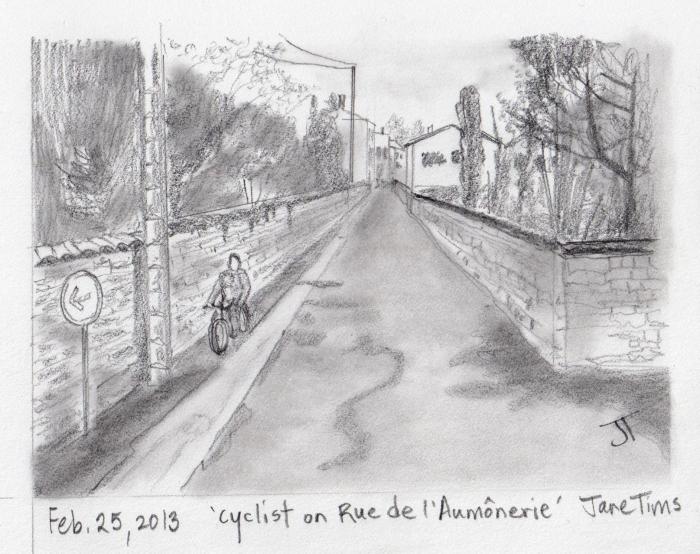 'cyclist on Rue de l'Aumonerie'