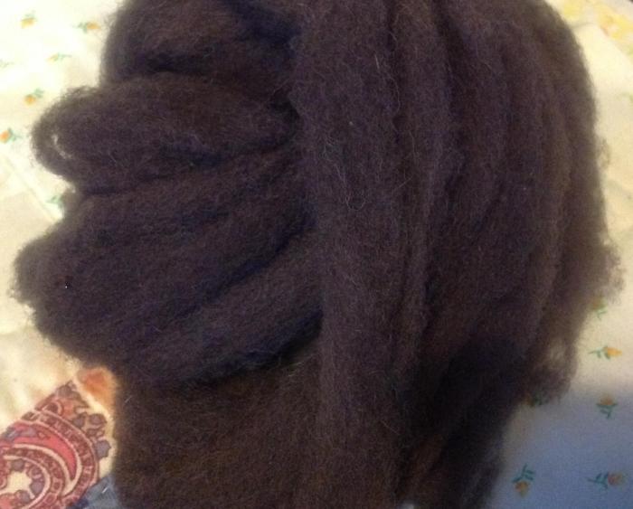 dark brown, almost black, wool, alum treated and simmered with oak leaf dye and iron acetate