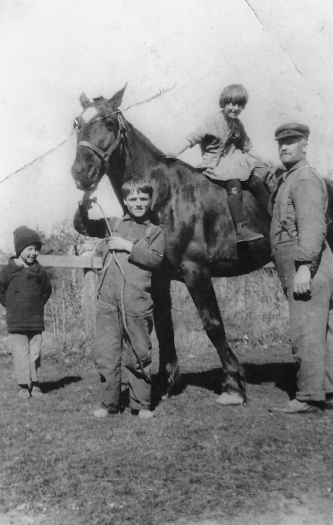 Dad as a boy holding horse